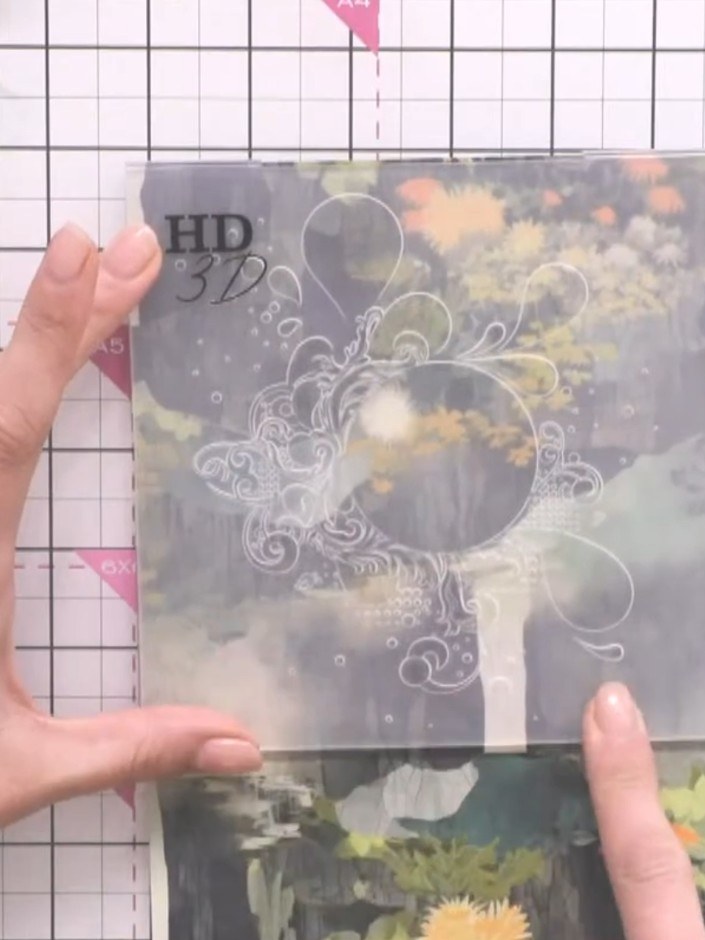 Step 3: Place the paper into the Grunge Splash embossing folder, ensuring it is positioned correctly within the folder
