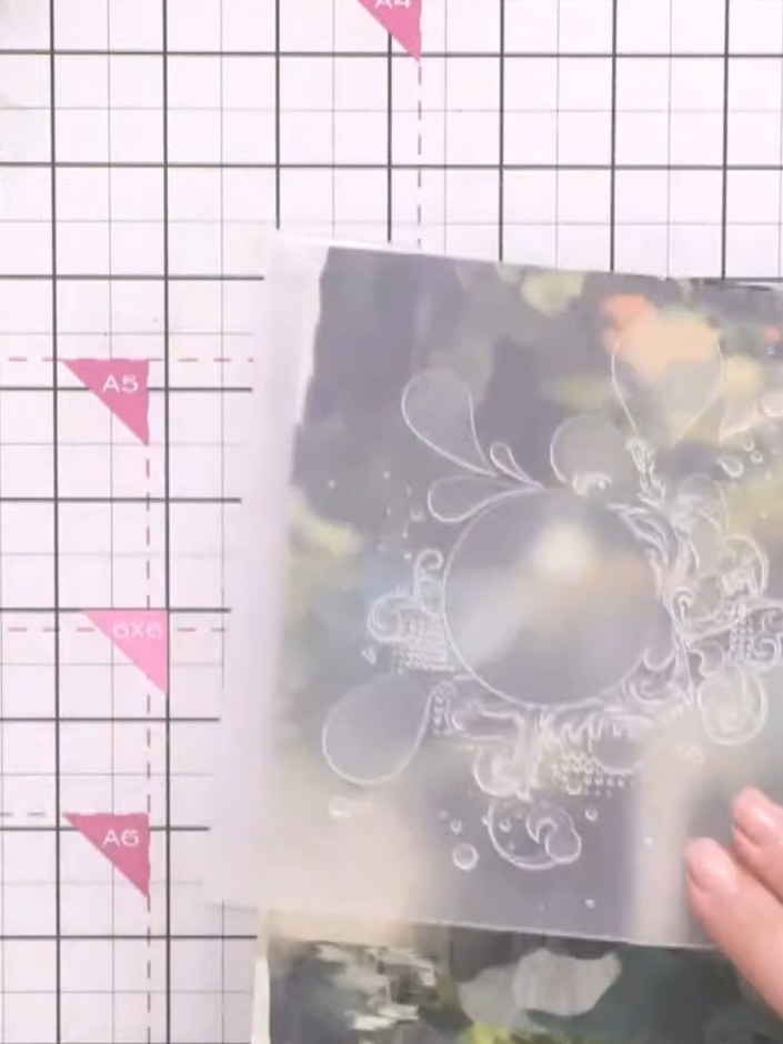Step 4: Place your paper inside the Grunge Splash embossing folder. Run the folder through your die-cutting and emboss