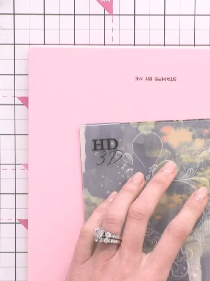 Step 6: Apply white ink pad over the embossed surface, dabbing gently to highlight the raised texture and create contr