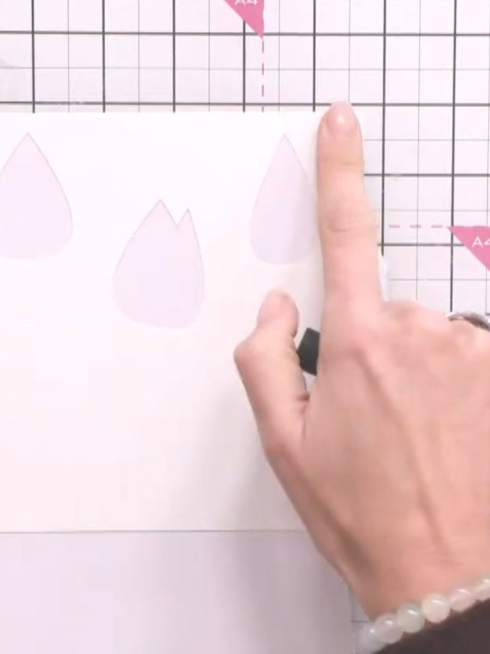 Step 6: Continue layering the remaining stencils from the Dotted Tulips set, using different colours to build up the c