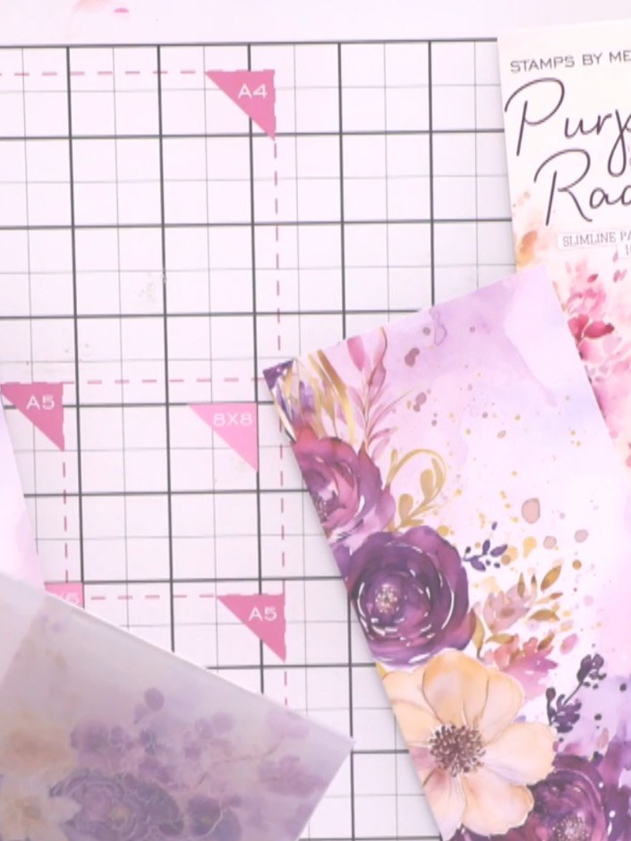Step 1: Select a piece of decorative paper from the Purple Radiance pad. Position the paper inside your embossing fold