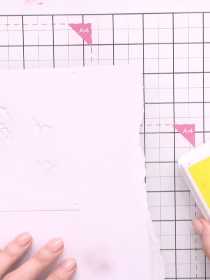 Step 4: Position stencil two over your card and ink through with a darker shade of yellow ink using a blending tool.