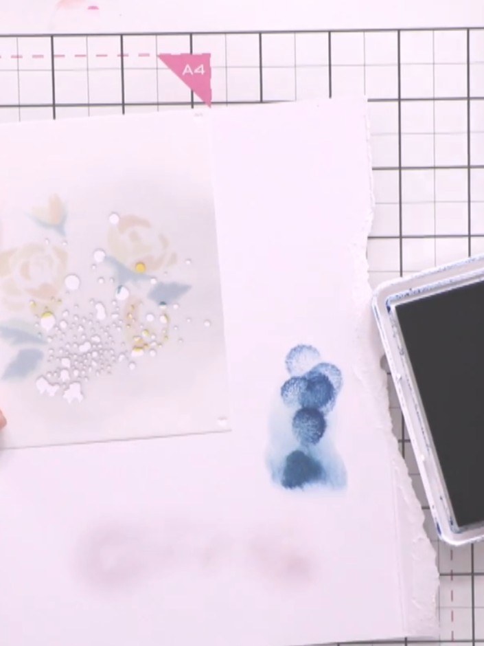 Step 7: Apply stencil five using darker teal ink to add depth to your design. Use a small amount of ink and dab gently