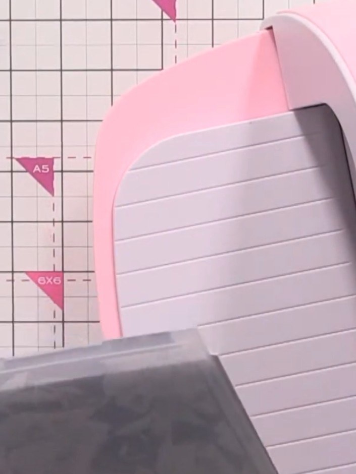 Step 5: Place the inked embossing folder onto the wet watercoloured card. Position it carefully, then run the card and