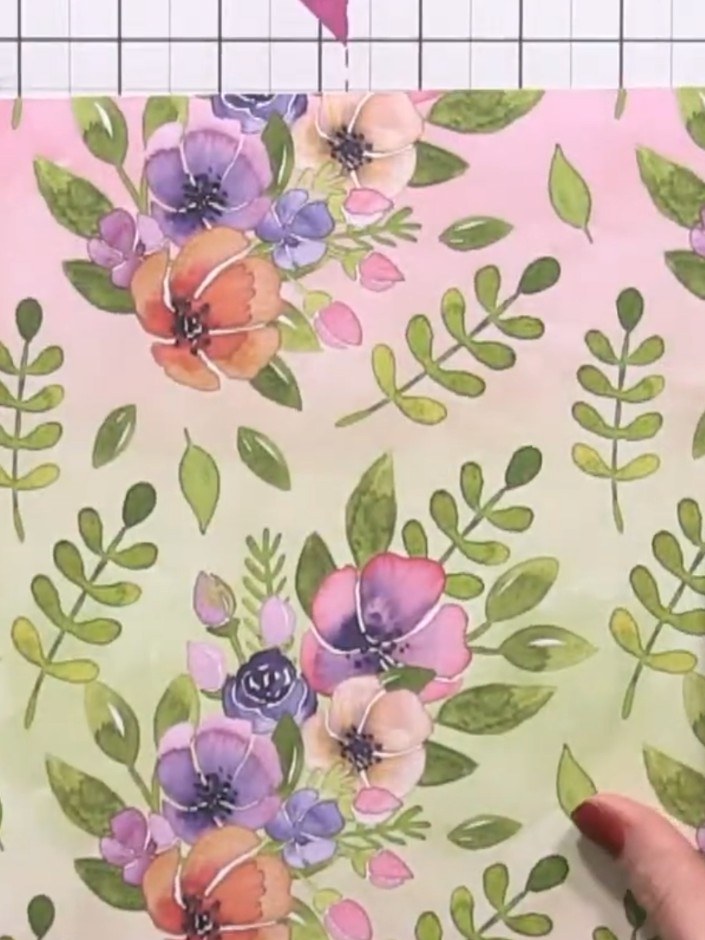 Step 1: Select a 12x12 inch square piece of patterned paper from your collection. Place the decorative paper on your c