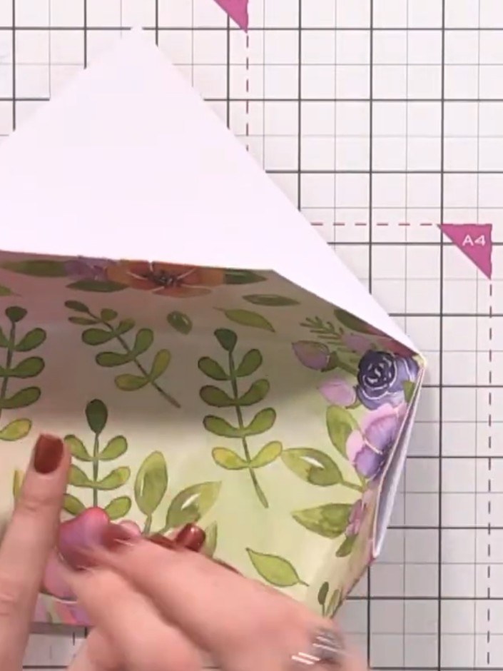 Step 8: Push the side flaps upwards and secure them down with glue or tape to complete the pocket structure of the wal
