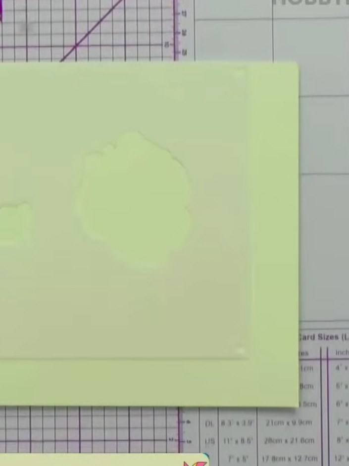 Step 1: Prepare a cream or pale green card blank as your base. The card should be folded to create a standard greeting