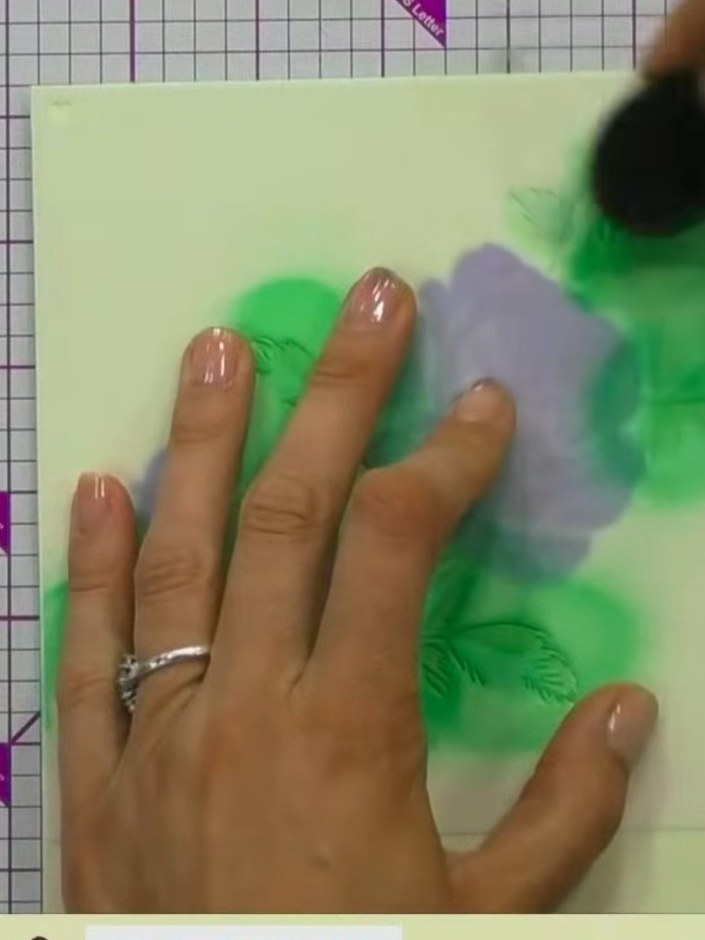 Step 10: For a watercolour effect, lightly spray the stencilled design with water using a spray bottle. The water will 