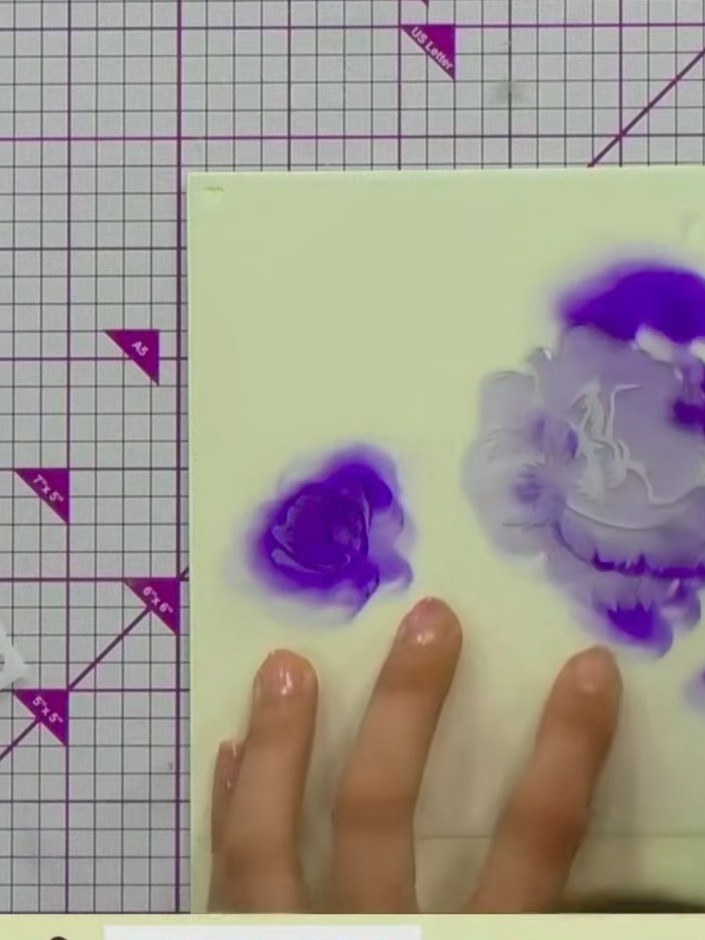 Step 4: Position stencil number two over your rose design and apply the same purple ink with slightly more pressure to