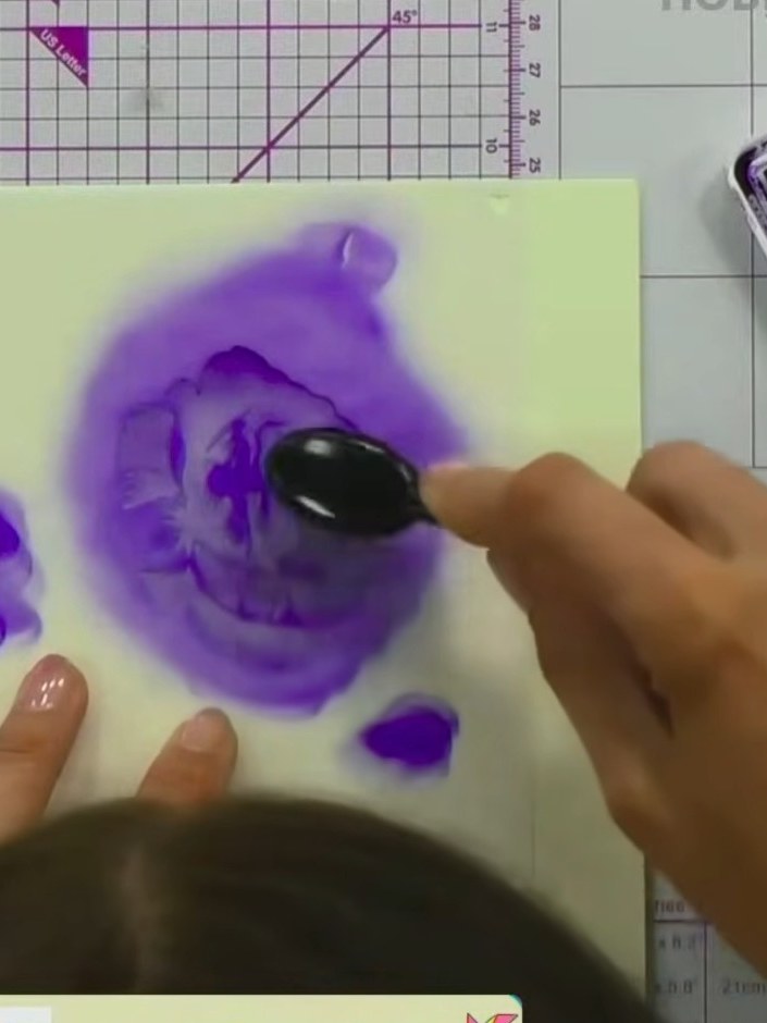 Step 5: Position stencil number three over your rose design and apply purple ink using a blending tool. Press more fir