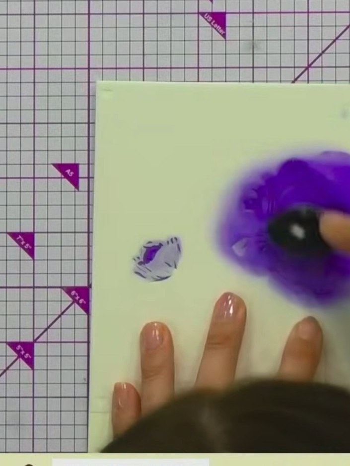 Step 6: Position stencil number four over your card and apply purple ink using a blending tool. Press firmly to create