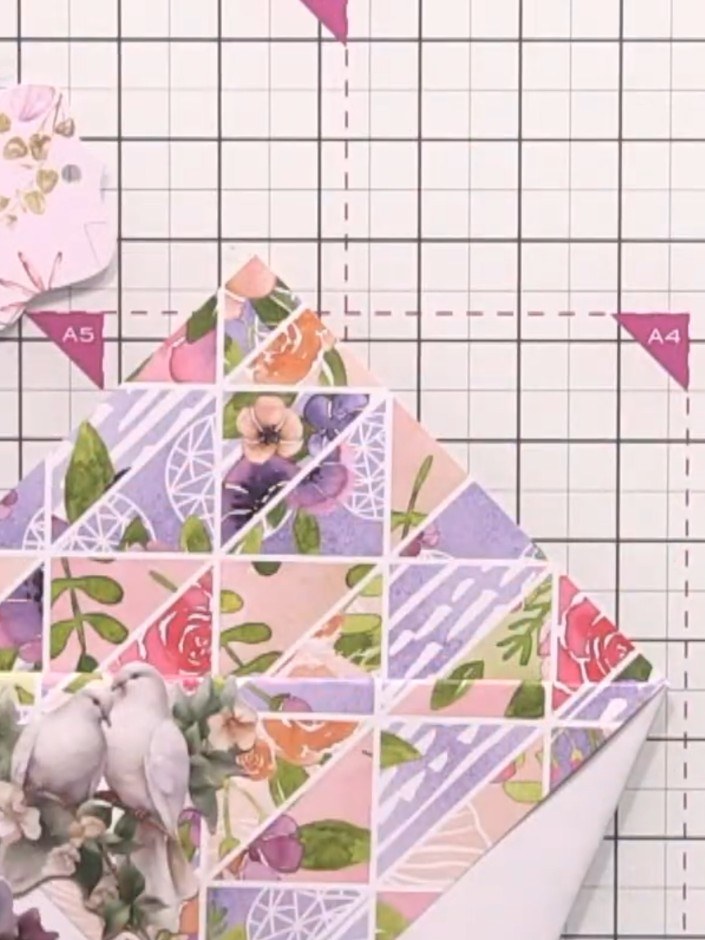 Step 3: Arrange floral elements including the decorative bird and flower embellishments on the front of your hexagonal