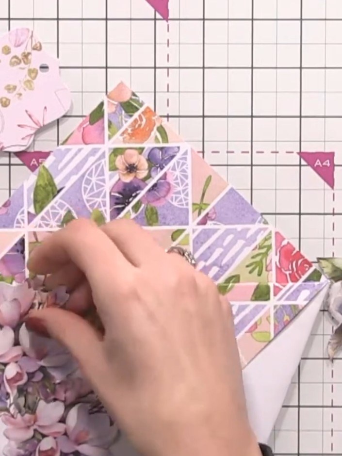 Step 4: Adhere floral embellishments to the left side of the patchwork panel using glue or 3D foam pads for dimension.