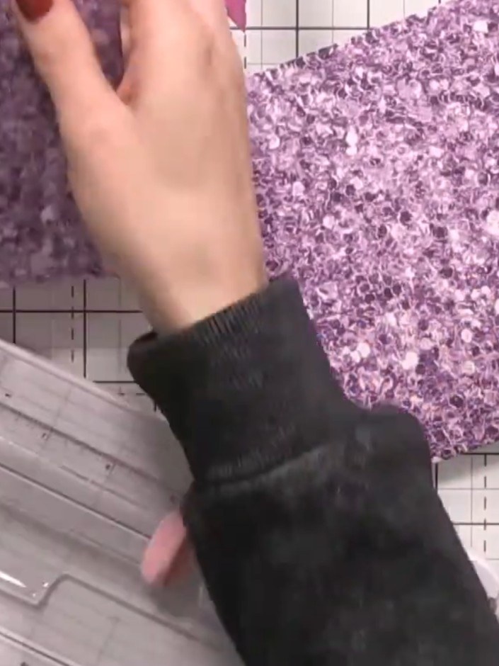 Step 7: Add a panel of purple glitter paper to the front of your insert card. Layer additional embellishments such as 