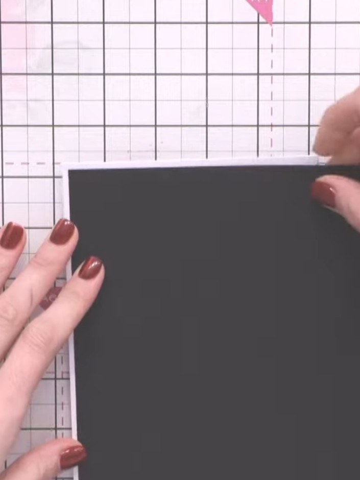 Step 1: Cut a black card layer and a patterned layer from the Evergreen paper using a guillotine. Trim them to create 