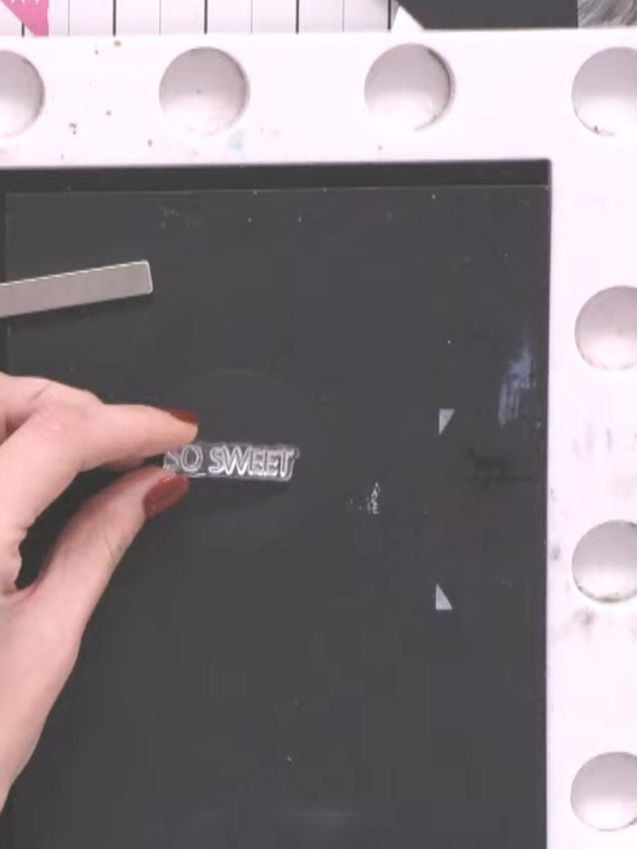 Step 6: Use the 1 inch circle punch to punch a circle from black cardstock. Stamp the 'So Sweet' sentiment onto the bl