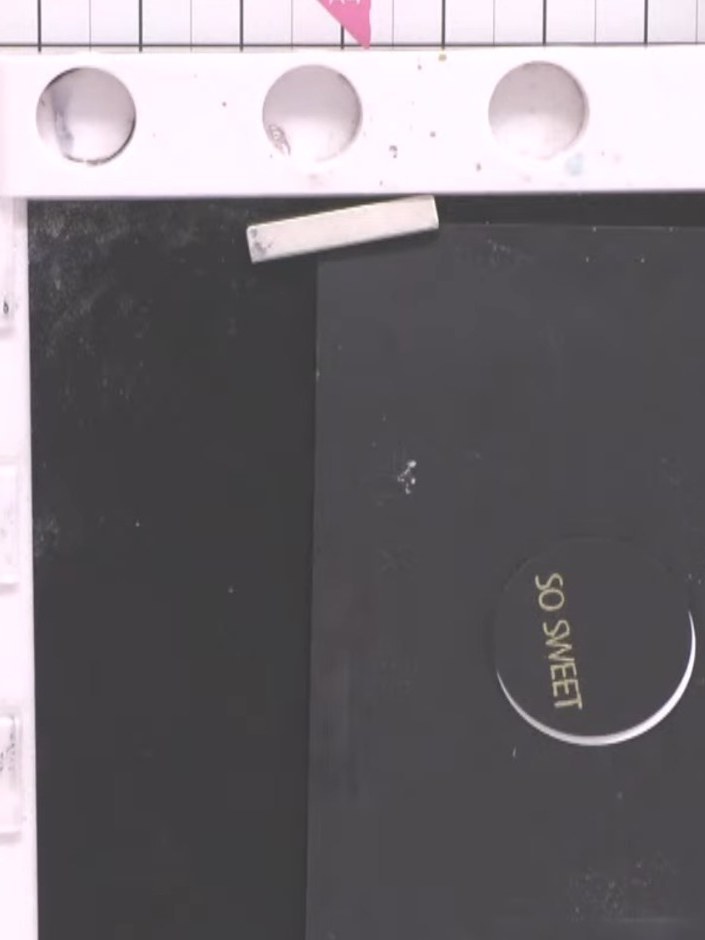 Step 8: Using a white gel pen, draw a line around the embossed 'SO SWEET' sentiment circle to add definition and break