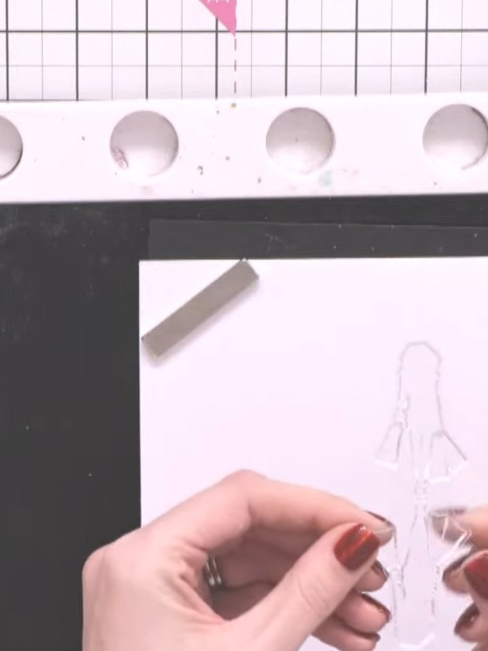Step 3: Stamp the lady image from the Reflection stamp set onto the upper portion of a white top-folding card using bl