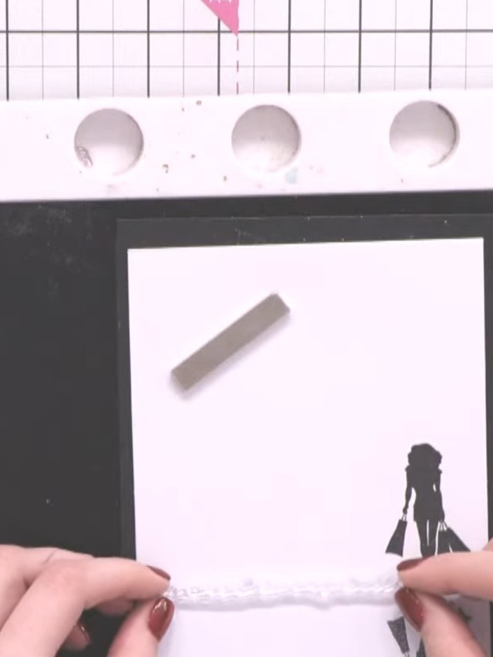 Step 4: Stamp a long thin sentiment such as 'Hello' in black ink below the lady silhouette image on the white card pan