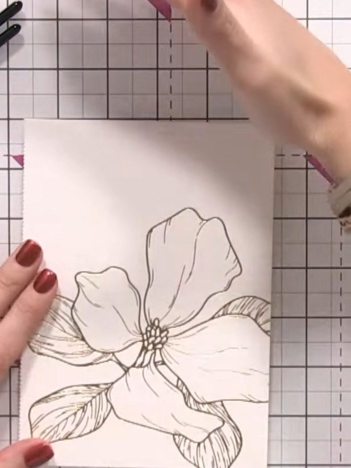 Step 2: Using a clean flat brush, wet the entire surface of the stamped floral image with clean water to prepare it fo