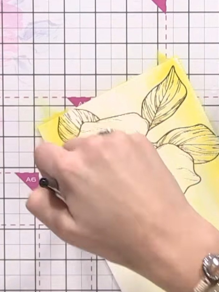 Step 3: Apply a light wash of yellow watercolour across the wet card using a brush. Vary the tone in places to create 
