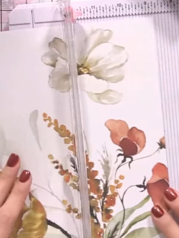 Step 11: Cut a panel from coordinating floral paper to fit the inside front cover. Apply glue to the back of the panel 