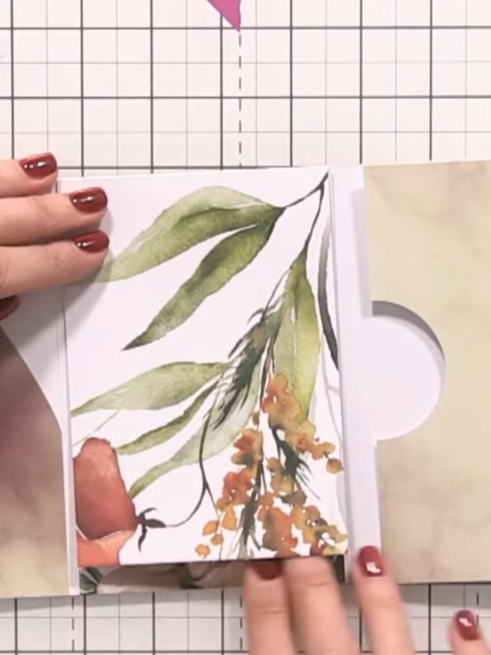 Step 12: Embellish the album pages with decorative toppers and coordinating paper scraps. Layer the floral and animal m