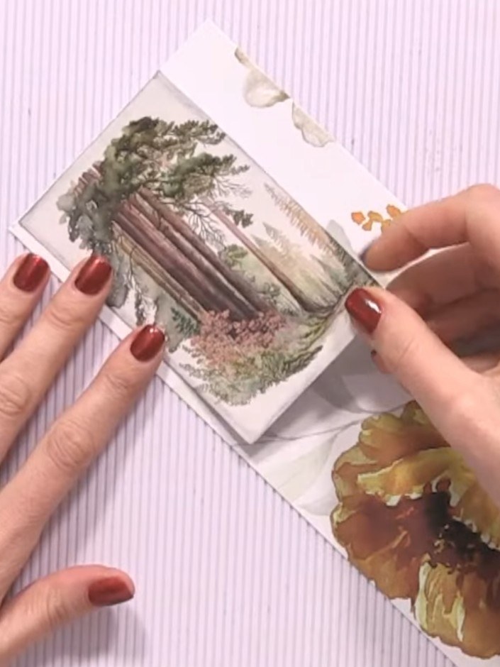 Step 14: Add the final decorative scene panel to the front cover of your album. Position the panel with the forest scen