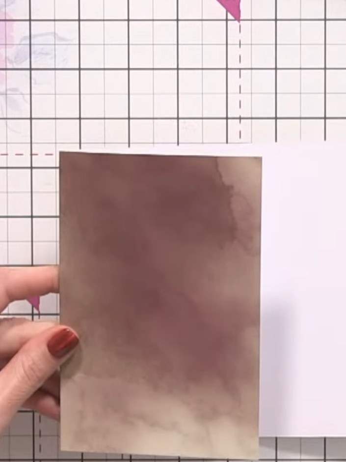 Step 6: Cut a curved arch from the bottom edge of the brown ombré section freehand with scissors to create a pocket op