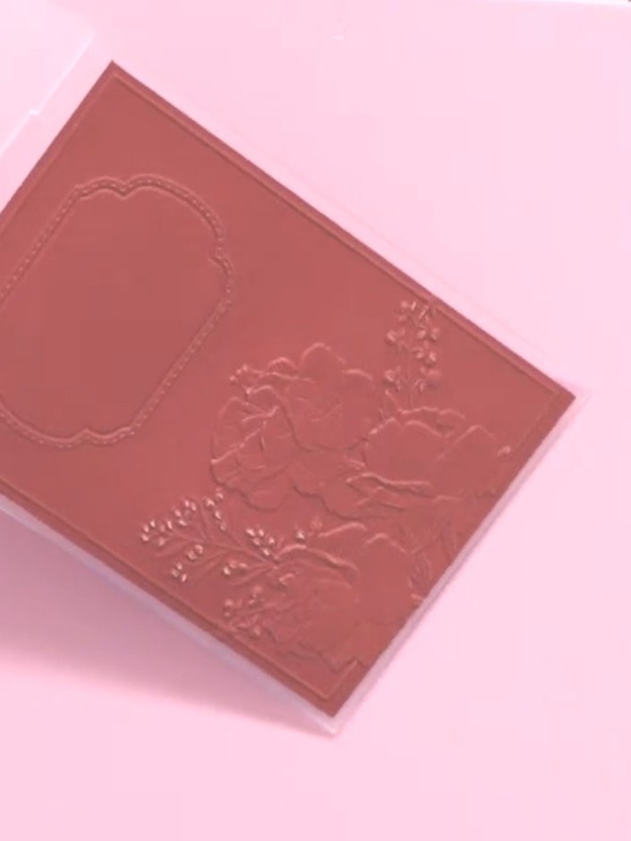 Step 5: Lower the hinged door of the embossing machine and turn the hand crank smoothly to run the embossing plate and