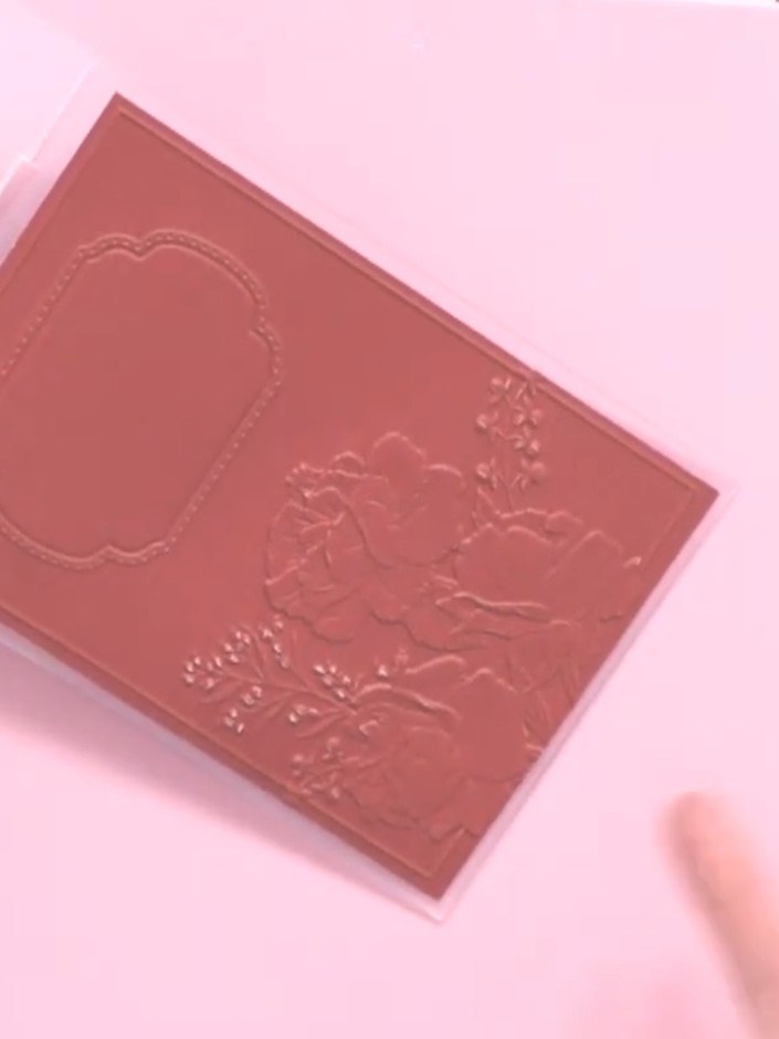 Step 6: Remove the embossed cardstock from the folder and admire the raised rose and frame detail created by the embos