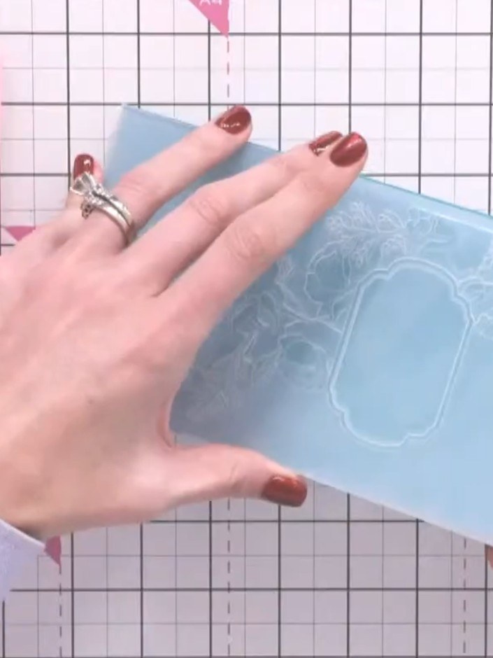 Step 4: Place the inked embossing folder onto the pink base plate of your die-cutting machine, with the embossed desig