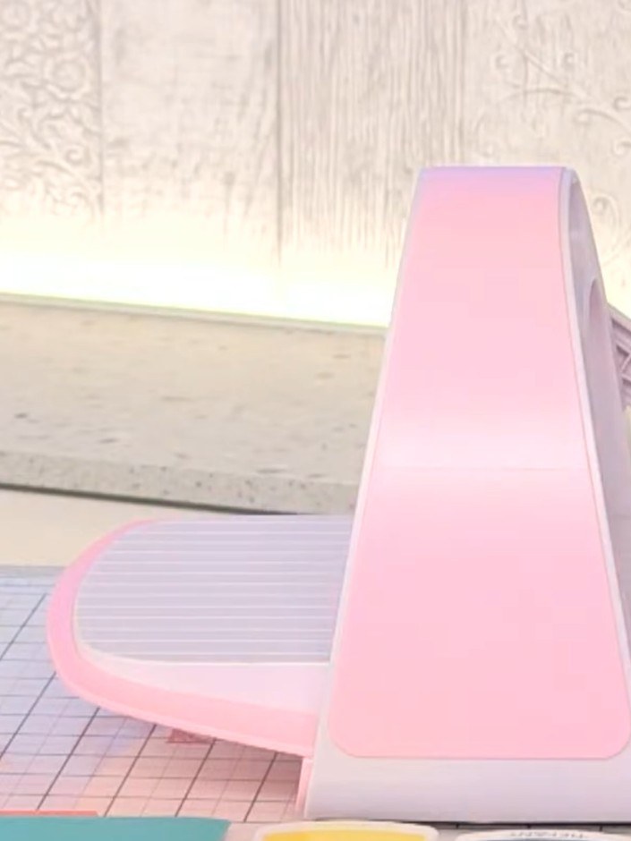 Step 2: Ink the raised side of the mini All Occasions embossing folder with pink ink pad, ensuring even coverage acros