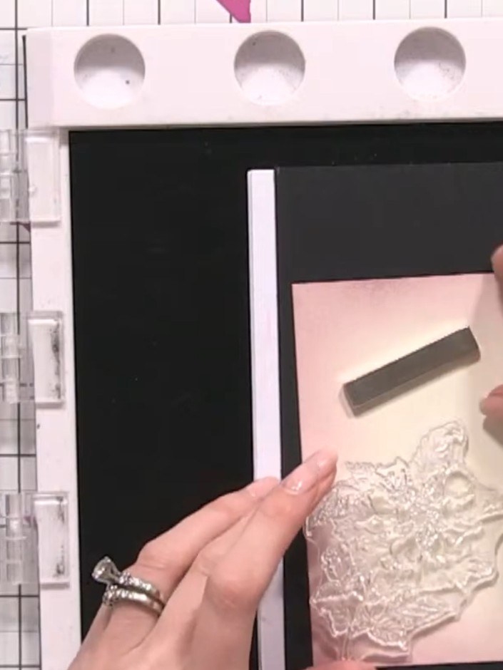 Step 4: Stamp the main floral head from the lamination stamp set in black ink, positioning it coming in from the corne