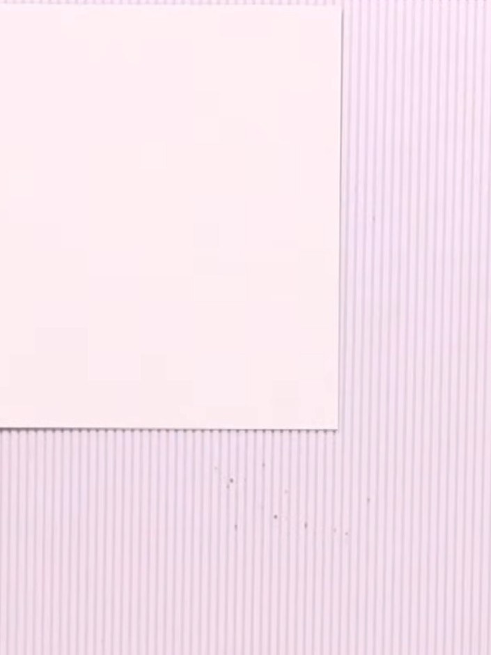 Step 1: Take a 6x6 inch paper from your pad and score a half-inch line along one edge using your scoring board to crea