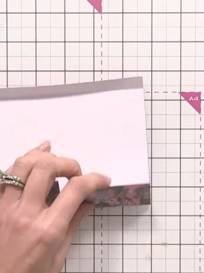 Step 7: Fold the two flaps with the floral pattern inward to create your side pockets. Use adhesive to secure the flap