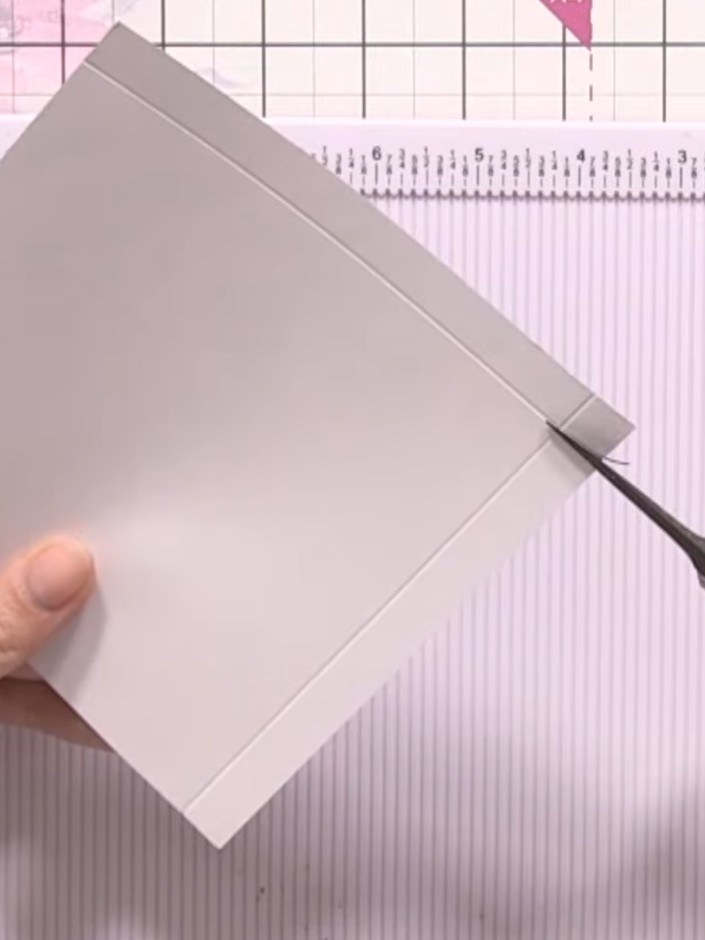 Step 3: Cut away the small square where the two score lines meet to remove bulk from the card.
