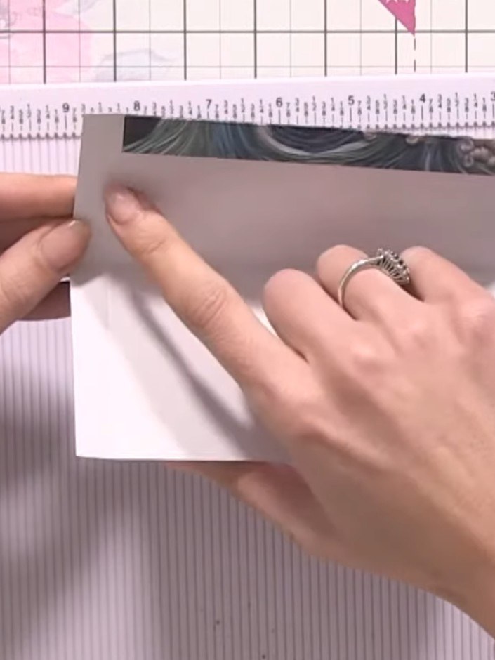 Step 9: Trim away any excess hinge material from the edges of your fold-out page to reduce bulk before adding it to yo