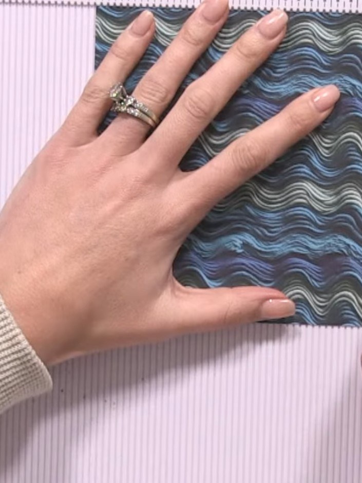 Step 1: Score a half-inch hinge along one edge of your 6x6 patterned paper using your scoring tool.