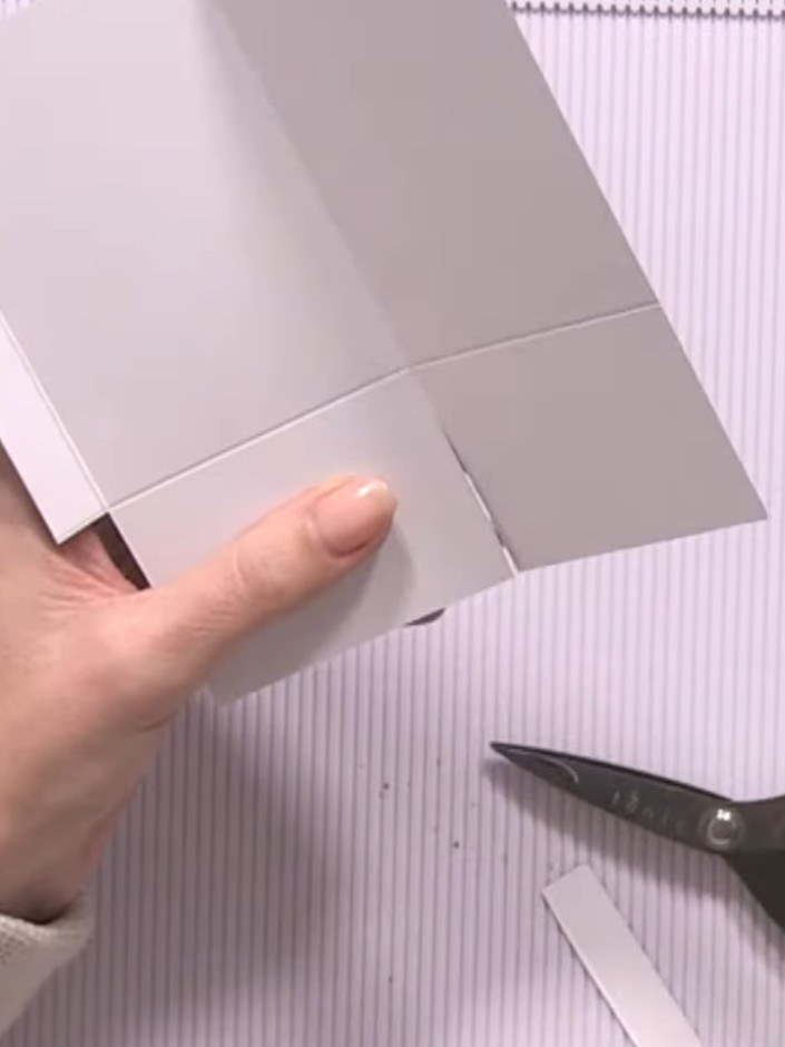 Step 10: Seal the back pocket by applying adhesive tape or glue along the open edges to secure the pocket in place.