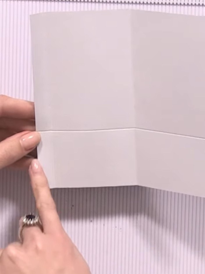 Step 7: Apply adhesive tape or glue along the side edges of the pocket to seal them closed. Press firmly to secure the