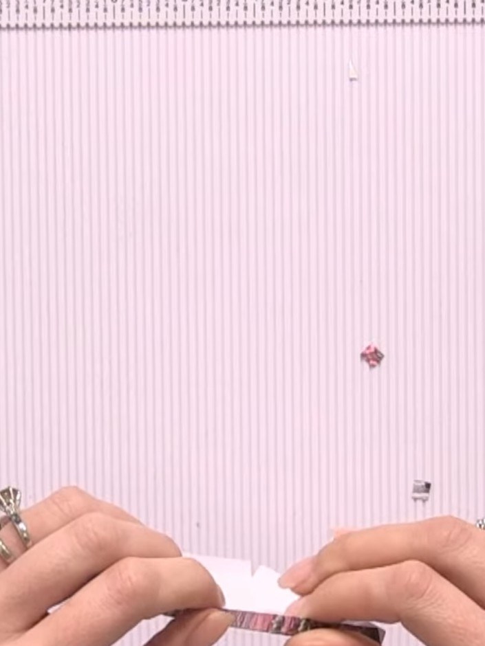 Step 6: Use the 1-inch circle punch to punch a hole at the top centre of your white pocket piece to create the opening