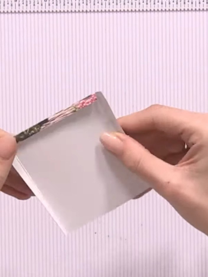 Step 7: Apply double-sided tape or glue along the side edges of your pocket to seal them together. Press firmly to sec