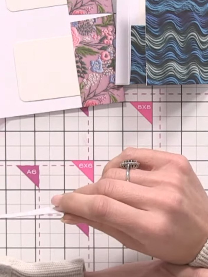 Step 1: Score a half-inch hinge along one edge of your 6x6 patterned paper using your scoring board.