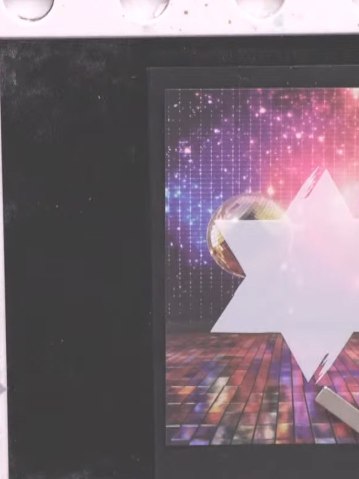 Step 1: Select a piece of Disco Fever paper featuring the glitter ball background design to use as your card base.