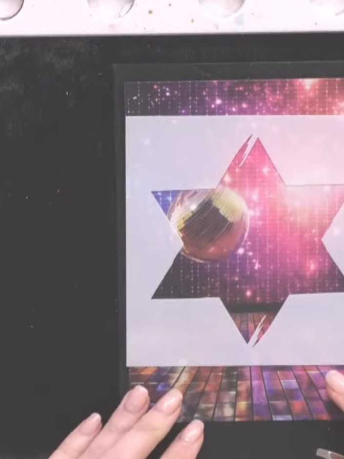 Step 2: Position the star stencil over the disco ball image on your card front, placing it slightly off-centre to crea