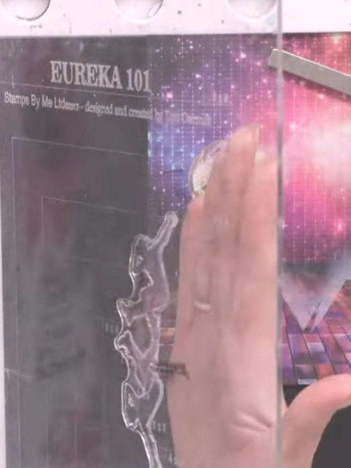 Step 7: Ink up the entire reflection stamp with black ink and stamp it firmly onto the black card. Position the image 