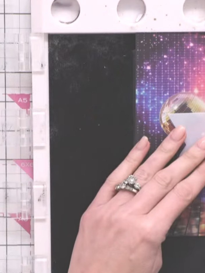 Step 9: Position the reflection stamp over the top portion of the disco ball image and stamp again to enhance the refl