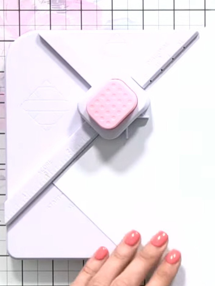 Step 1: Cut a 12 by 12 inch piece of white card stock. Place the Stamps By Me Box and Envelope Maker tool on the card 