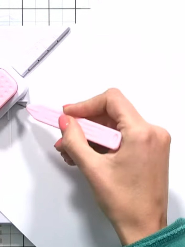 Step 3: Using the XL punch, punch the first hole on the XL start line marked on your card.